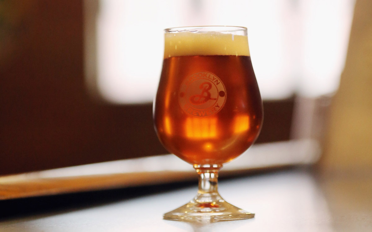 A glass of beer is displayed on the bar at Brooklyn Brewery on October 23, 2012 in the Brooklyn borough of New York City. 