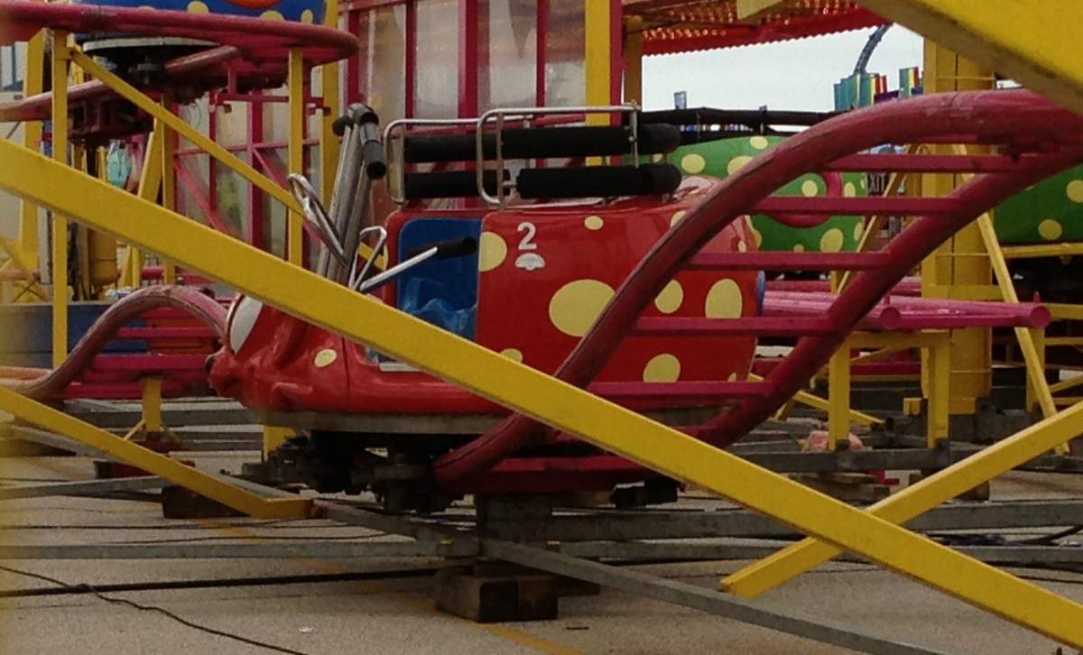 Where a 16-year-old boy was struck by a roller coaster at the Red River Ex.