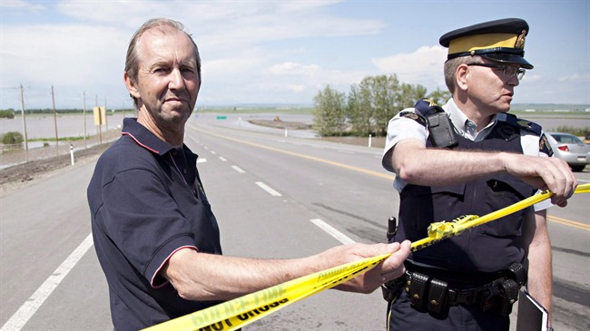 High River Mayor Emile Blokland and RCMP Staff Sgt. Brian Jones in High River, Alta. on Sunday, June 23, 2013. 