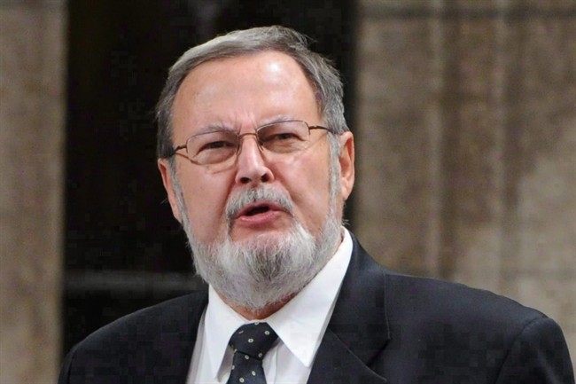 Conservative MP Peter Goldring stands during Question Period in the House of Commons on Parliament Hill in Ottawa on November 21, 2011.
