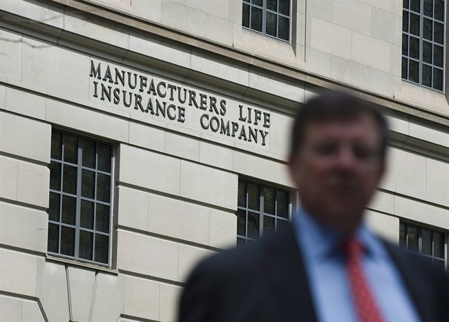 A man is seen outside the Manulife Financial head office in Toronto on May 3, 2012.