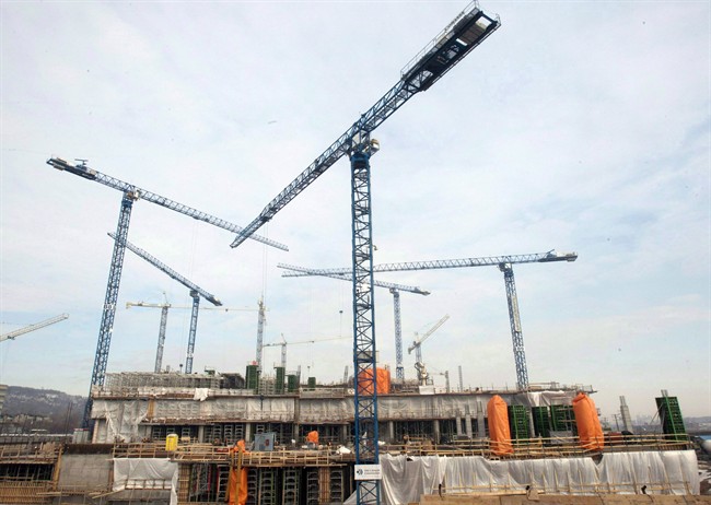 Cranes are shown at a construction site in Montreal.
