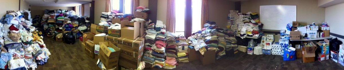 Donations pile up at the makeshift Drop-In Centre. Courtesy of Brogan McPherson.