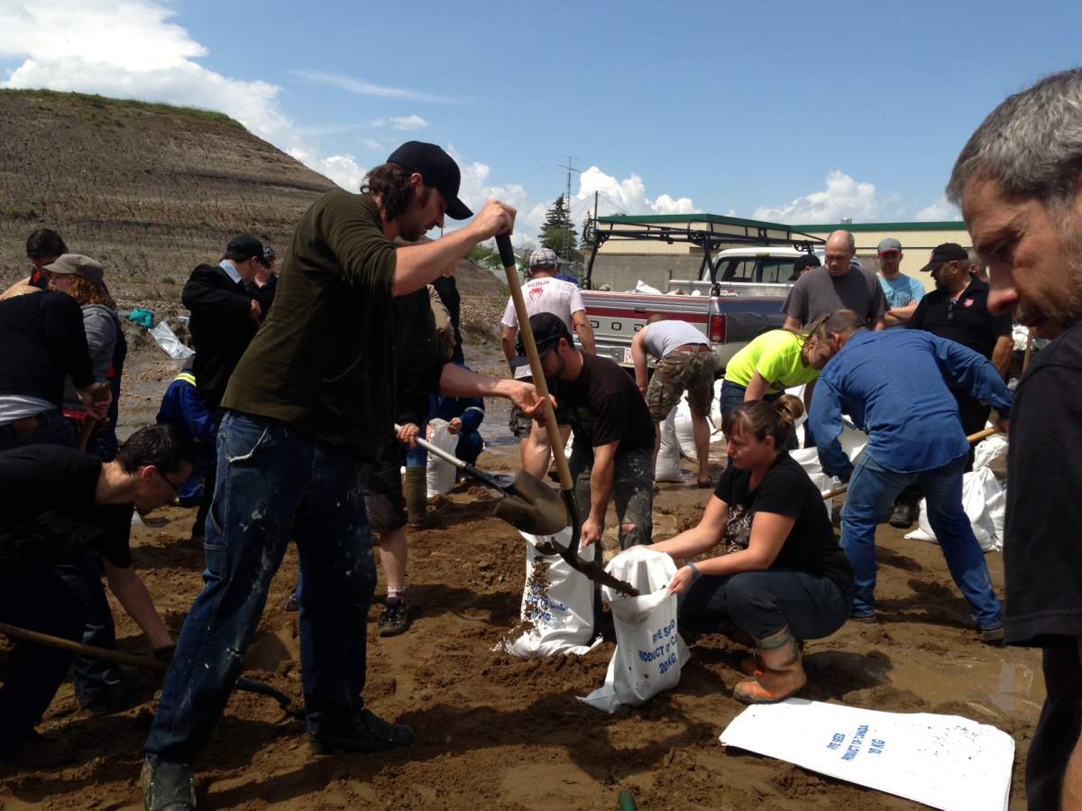 Citizens fill sandbags in Drumheller, Alberta.