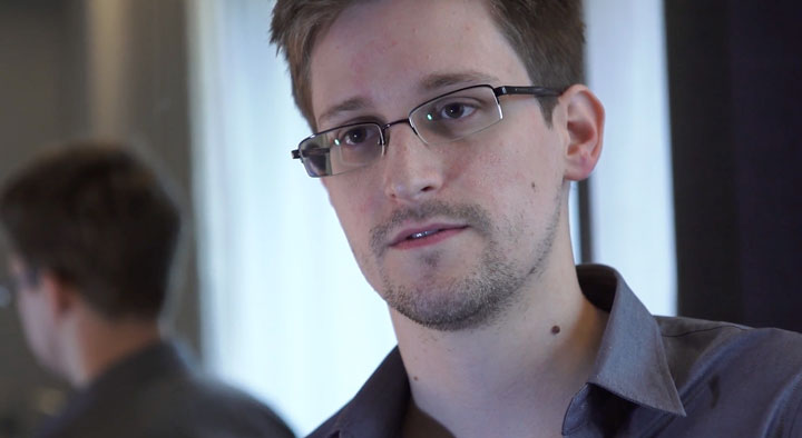 In this handout photo provided by The Guardian, Edward Snowden speaks during an interview in Hong Kong. Snowden, a 29-year-old former technical assistant for the CIA, revealed details of top-secret surveillance conducted by the United States' National Security Agency regarding telecom data.  