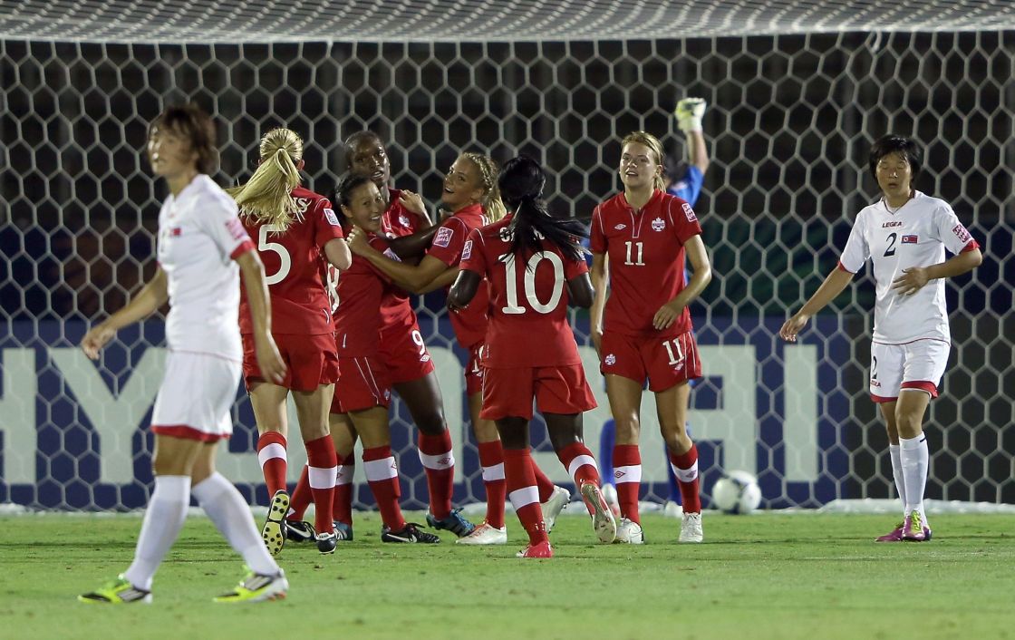 Christine Exeter #9 of Canada celebrates with team-mates after scoring the opening goal during the FIFA U-20 Women's World Cup Japan 2012, Group C match between Canada and Korea DPR at Komaba Stadium on August 27, 2012 in Saitama, Japan.