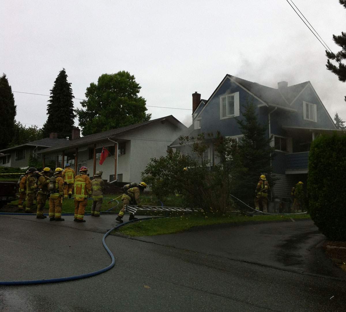 Burnaby firefighters on scene at the house fire on Kensington Avenue.