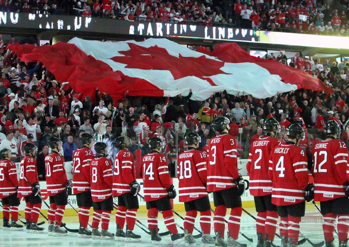 Fans move a large Canadian flag during the singing of the national anthems prior to a game of Team Canada against Team USA during the 2009 IIHF World Junior Championships held at Scotiabank Place on December 31, 2008 in Ottawa, Ontario, Canada. 