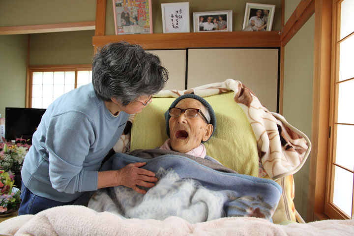 In this handout image provided by Kyotango City government, the world's oldest person Jiroemon Kimura speaks to granddaughter-in-law Eiko Kimura as he celebrates his 116th birthday at his home on April 19, 2013 in Kyotango, Kyoto, Japan. 