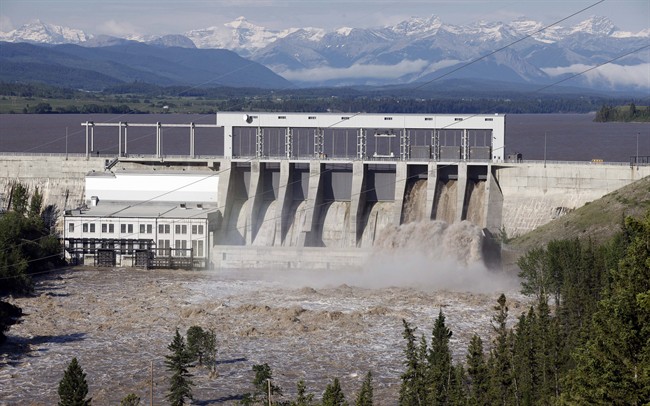 The Bow River pours through the Ghost Lake dam near Cochrane, Alta., Saturday, June 22, 2013.