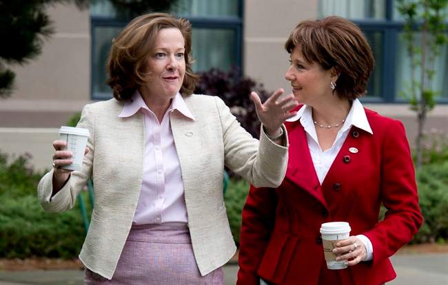 British Columbia Premier Christy Clark, right, and Alberta Premier Alison Redford are seen prior to a closed door meeting in Kelowna, B.C. Friday, June 14, 2013. 