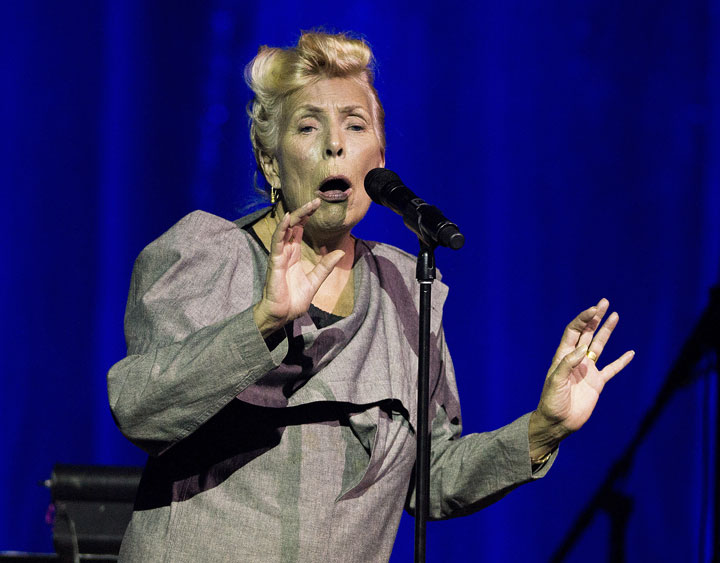 Joni Mitchell sings on stage during a 70th birthday tribute concert at Toronto's Massey Hall.
