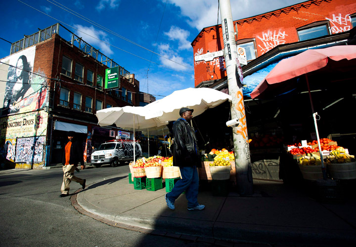 This Nov. 14, 2012 photo shows people walking around at Kensington Market in Toronto.