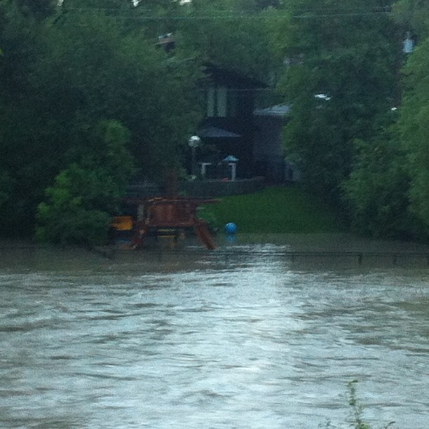 House along Elbow River during flood