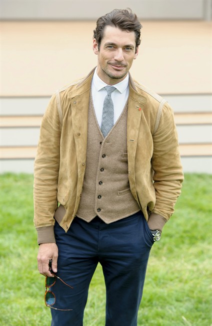 British model, David Gandy arrives for Burberry Prorsum show, during London Men's spring summer fashion collections 2014, in London, Tuesday, June 18, 2013. 