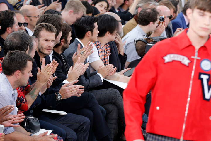 British football star David Beckam (2ndL) attends the men's ready-to-wear fashion show of British designer Kim Jones for Louis Vuitton fashion houseon June 27, 2013 in Paris.