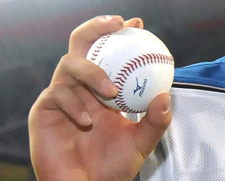 This picture taken on June 1, 2013 shows an official ball used in Japan's professional baseball official game of this season. Japan's professional baseball organization admitted it had secretly made its official ball fly longer this season to boost its appeal with more home-runs.      