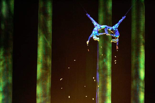 In this Nov. 28, 2008, photo, Sarah Guyard-Guillot, left, and Sami Tiaumassi perform as "Forest People" during Cirque du Soleil's "Ka" at MGM Grand Resort in Las Vegas. Guyard-Guillot, a mother of two young children, was pronounced dead at a hospital late Saturday night, June 29, 2013, after falling about 50 feet from the show's stage during a performance of Cirque du Soleil's "Ka." .