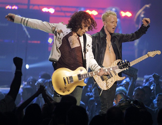 In a May 25, 2006, file photo Vivian Campbell, left, and Phil Collen, right, of rock group Def Leppard perform in Las Vegas.