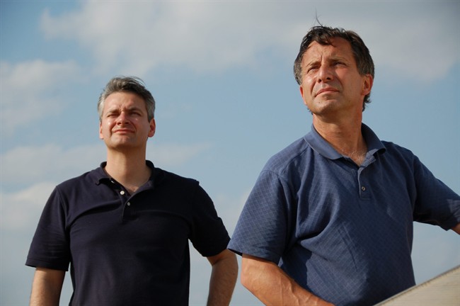 Carl Young, left, and Tim Samaras were both killed during the El Reno tornado in May along with Tim’s son, Paul.