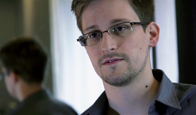 This June 9, 2013 photo provided by The Guardian newspaper in London shows Edward Snowden, who worked as a contract employee at the U.S. National Security Agency, in Hong Kong. 