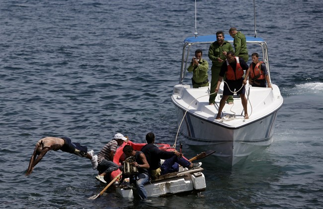 Cuban coast guards stop seven men trying to migrate illegally to the U.S. on a foam raft in 2009.