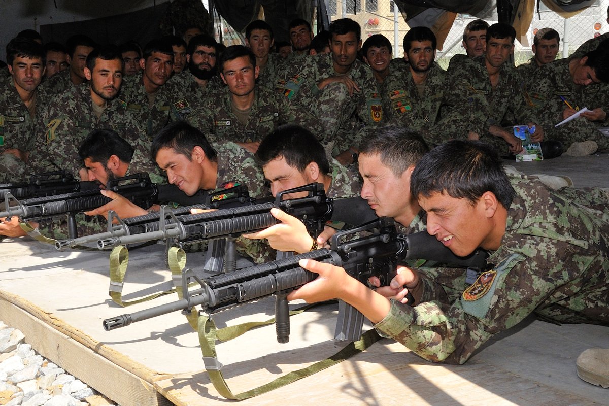 Afghan National Army Military Intelligence Company soldiers are taught a lesson, in July 2012, on the Test of Elementary Training (TOET) which includes immediate actions and stoppages on the M-16 rifle, before heading out to the ranges at the Consolidated Fielding Centre.
