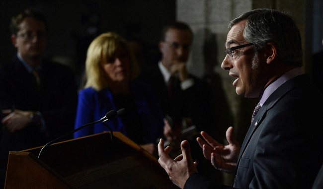 Treasury Board President Tony Clement speaks during a press conference on Parliament Hill in Ottawa on Monday, June 10, 2013.