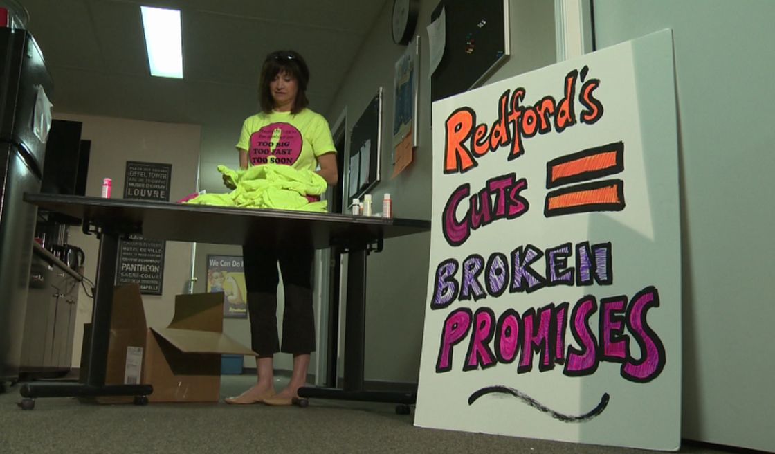 Marie Renaude, executive director of the Lo-Se-Ca Foundation, gets T-shirts ready for an upcoming rally.