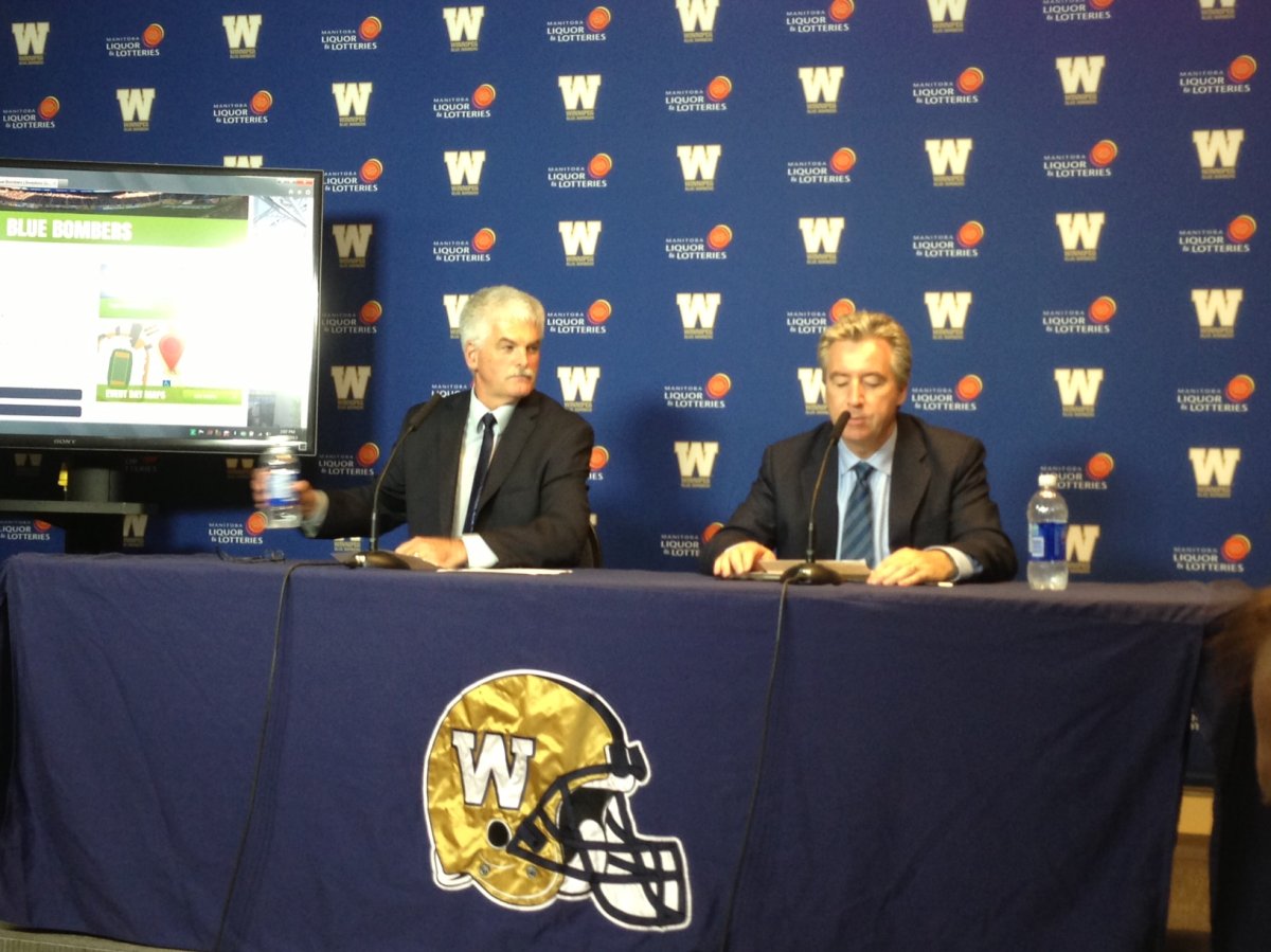 Winnipeg Blue Bombers vice president Jim Bell and Winnipeg Transit director Dave Wardrop at a news conference on June 21, 2013.