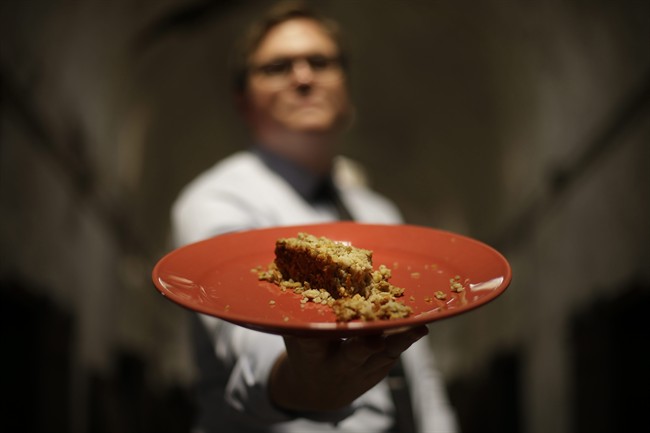 In this  photo, director of public programming, Sean Kelly displays a plate of Nutraloaf, presently served in Pennsylvania prisons .