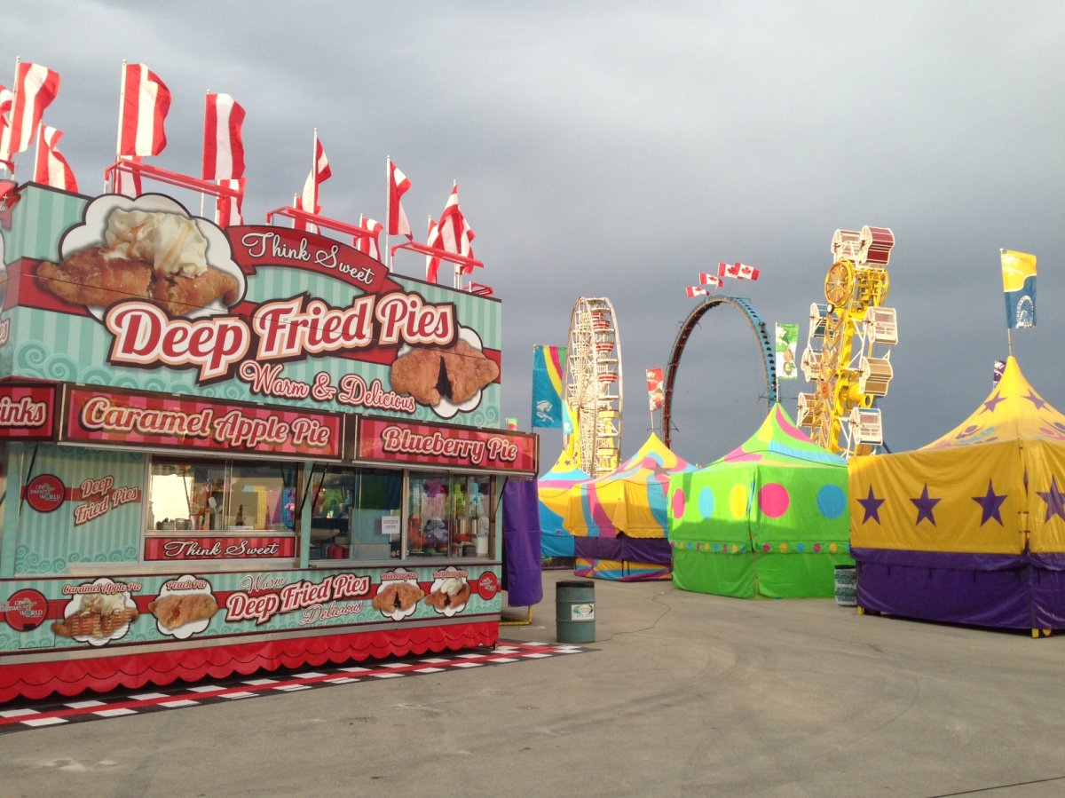 The colours of the midway stand out against a grey sky at the Red River Ex ahead of its opening Friday in Winnipeg.