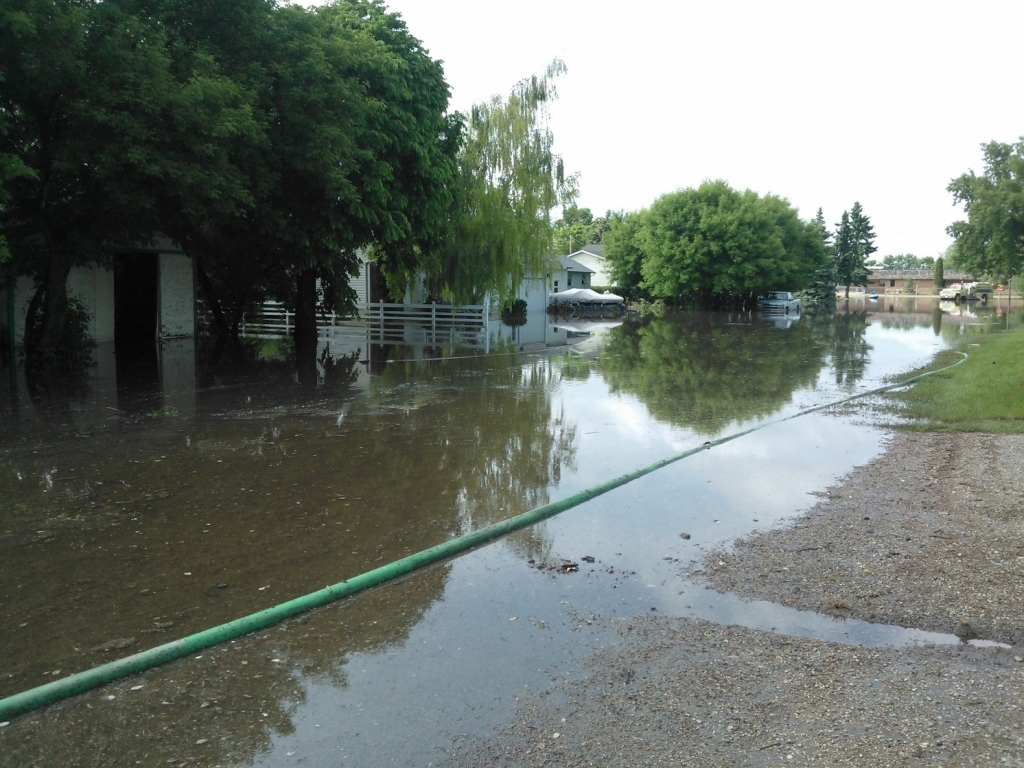 Water fills Reston, Man., streets on June 22.