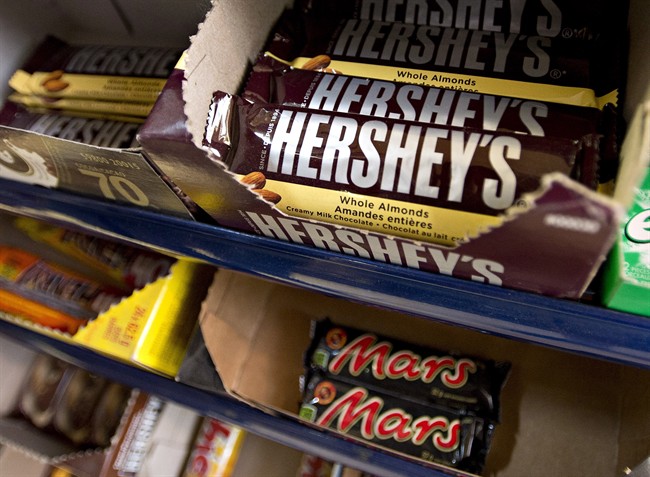 Hershey's and Mars chocolate bars are on display in a Montreal store on Friday, June 21, 2013 in Montreal.