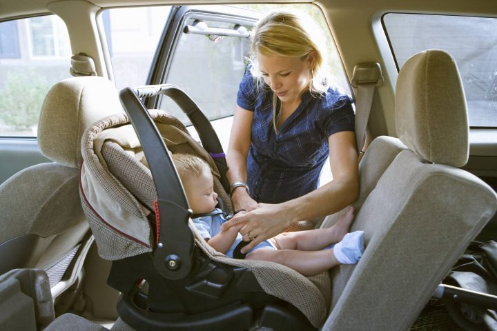 child in front seat alberta