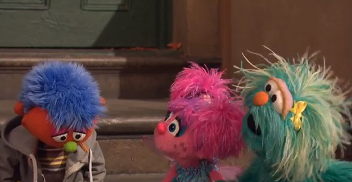 He has a head of blue hair, green nose and a wide smile. This is Alex and he’s the first muppet on Sesame Street with a parent behind bars.