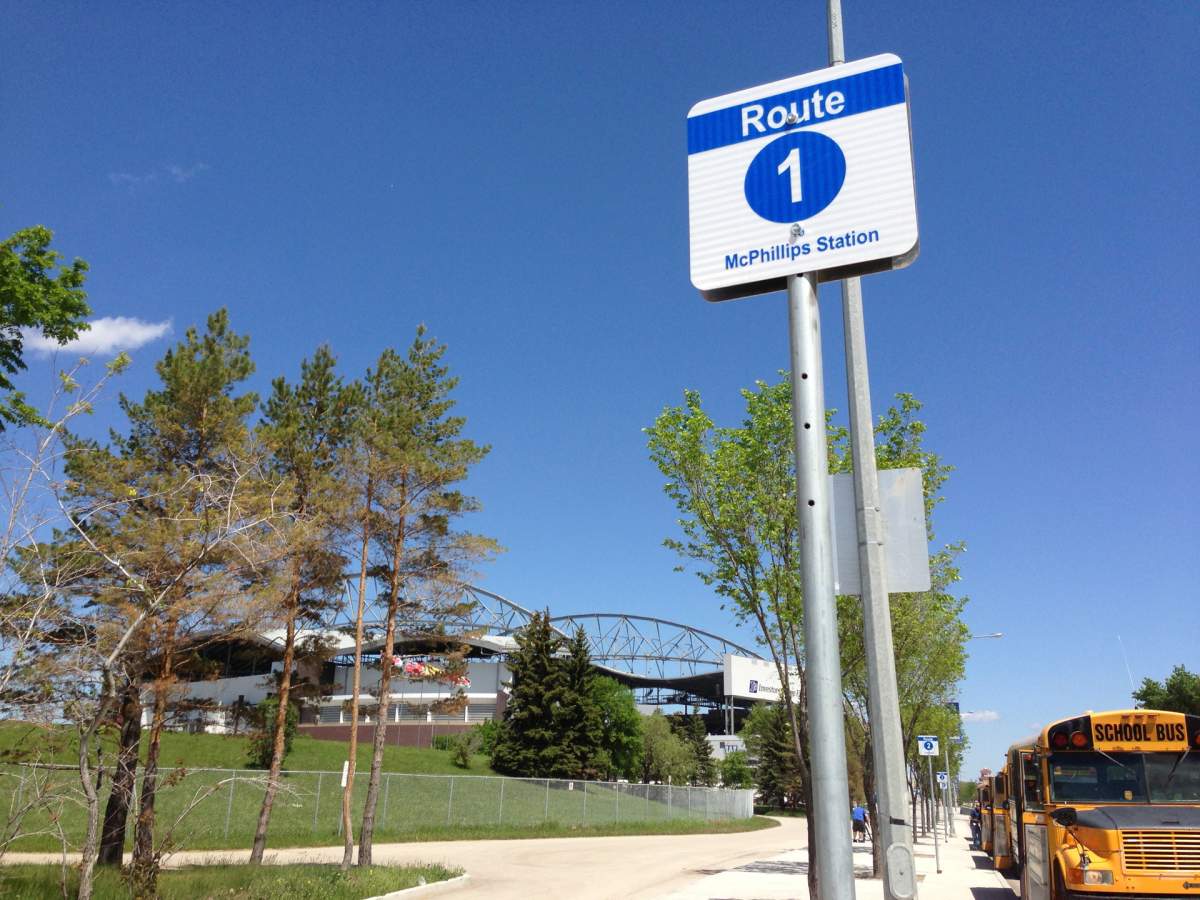 Signs outside Investors Group Field show where Winnipeg Transit buses will drop off and pick up Blue Bomber fans on game days.