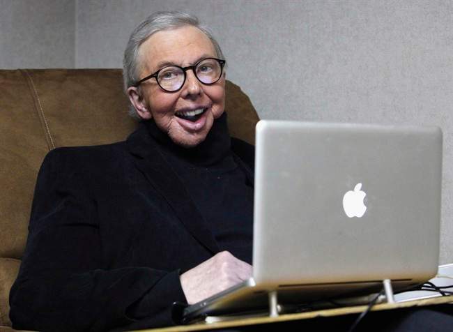 In this Jan. 12, 2011 file photo, Pulitzer Prize-winning movie critic Roger Ebert works in his office at the WTTW-TV studios in Chicago. Ebert, who worked at the Chicago Sun-Times for more than 40 years, took first place for online columns or blogs on large websites in the NSNC's annual column contest.