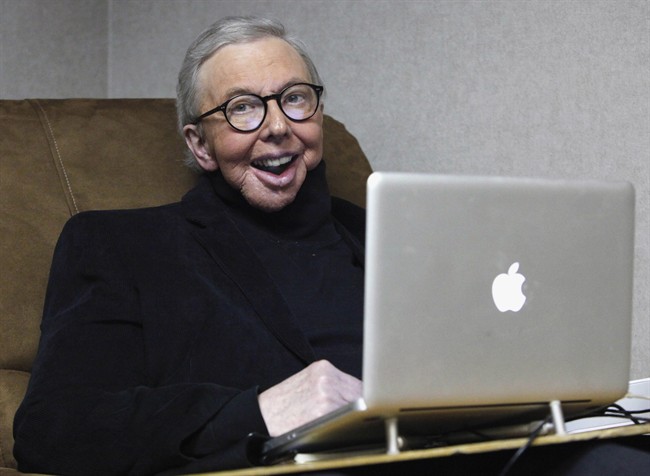 In this Jan. 12, 2011 file photo, Pulitzer Prize-winning movie critic Roger Ebert works in his office at the WTTW-TV studios in Chicago. Ebert, who worked at the Chicago Sun-Times for more than 40 years, took first place for online columns or blogs on large websites in the NSNC's annual column contest.