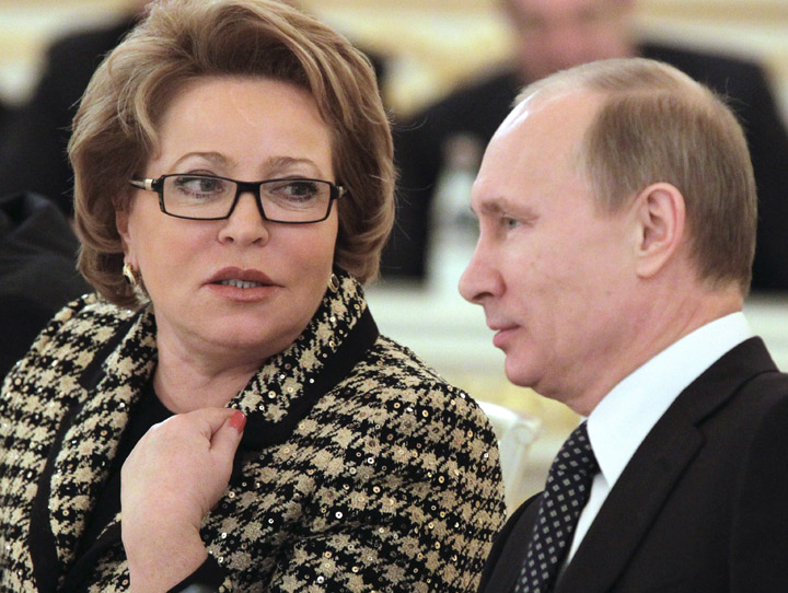 Russian Federation council chairwoman Valentina Matvienko (L) speaks with Prime Minister Vladimir Putin (R) during a State Council meeting of heads of Russia's entities in the Kremlin in Moscow on December 26, 2011. 