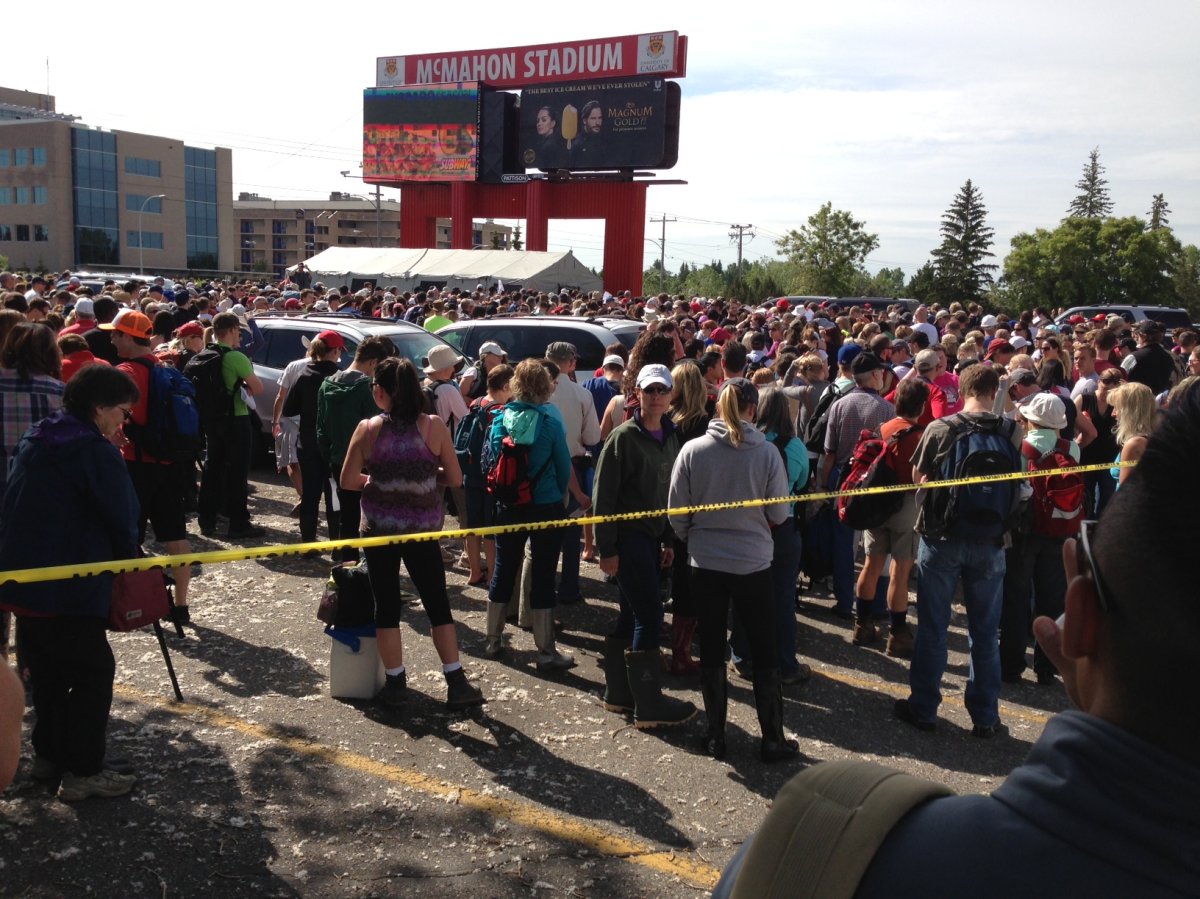 Volunteers gathered at McMahon Stadium on Monday, to help people returning home to flooded areas of Calgary.