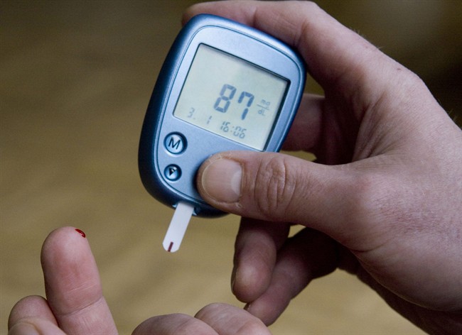 This Jan. 3, 2009 file photo shows a diabetic testing his level of blood sugar in Kamen, Germany.