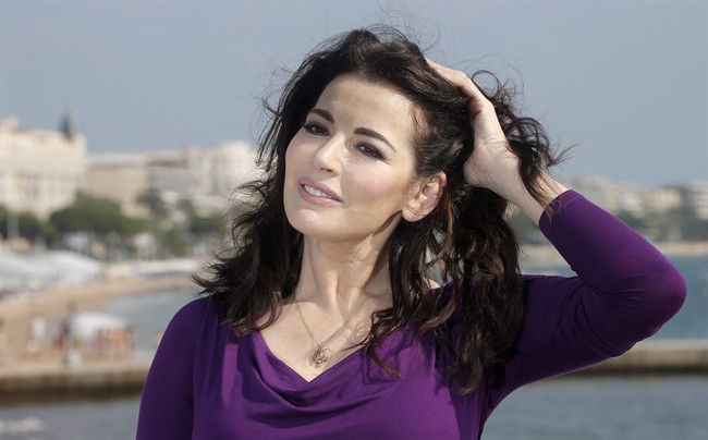 A British lawmaker has questioned the way police treated Nigella Lawson's husband after he admitted assaulting the celebrity chef.