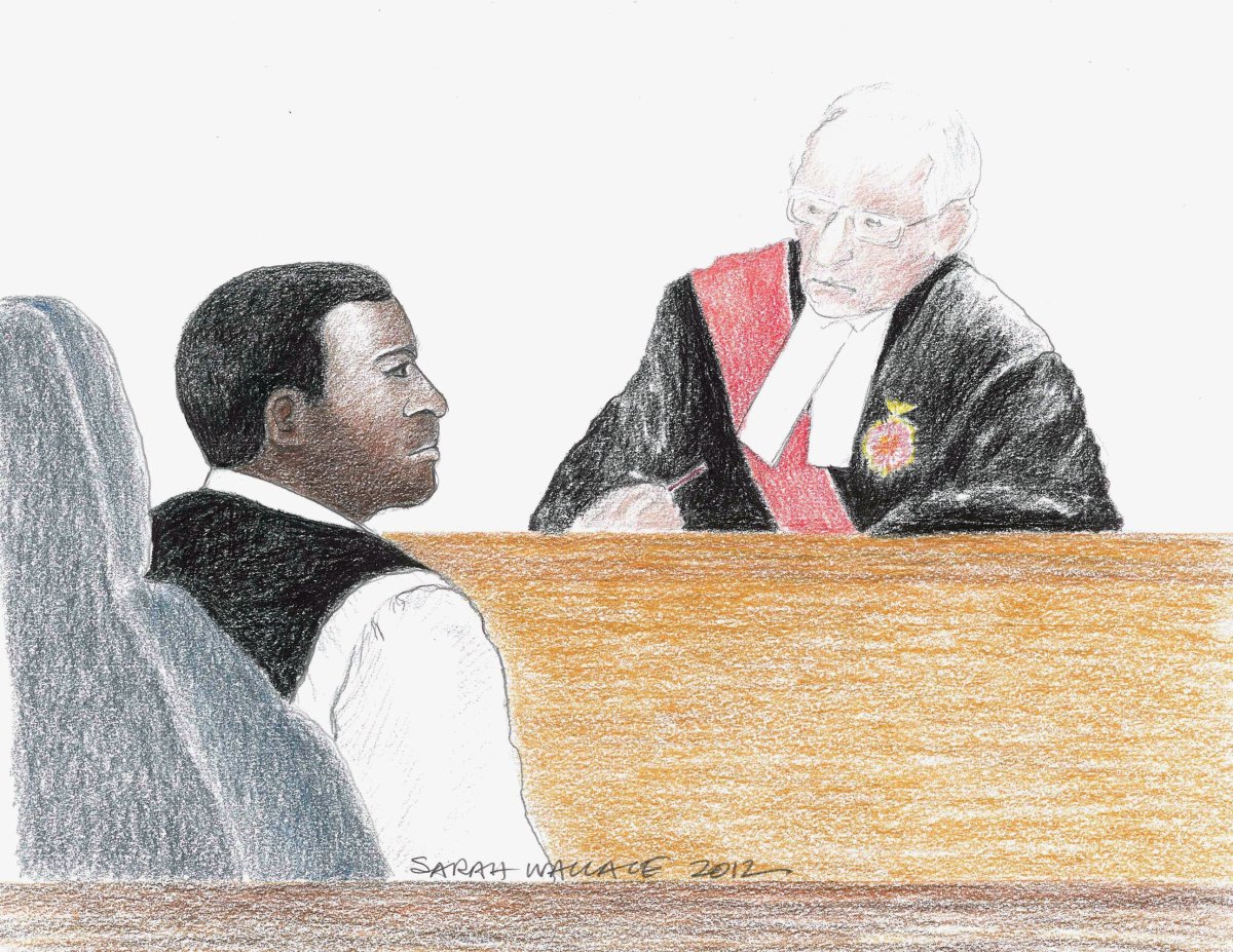 Jacques Mungwarere and Justice Charbonneau are shown in a courtroom in Ottawa on Monday, May 28, 2012. Mungwarere has been acquitted of genocide in Canada's second trial under the Crimes Against Humanity and War Crimes Act on Friday.