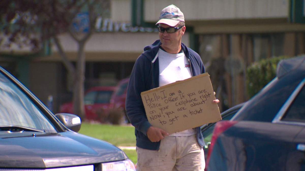 Undercover police officer in Edmonton conducts a distracted driver sting. July 25, 2013