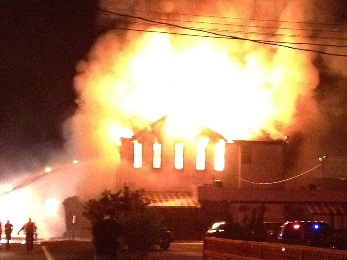 Flames broke out at the Tudor House Pub shortly after 2:00 a.m. According to eyewitnesses, the building has been completely destroyed.  Credit: Cameron Dopler
.
