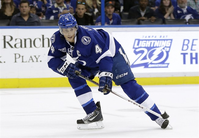 FILE – In this Feb. 2, 2013 file photo, Tampa Bay Lightning center Vincent Lecavalier moves down the ice against the New York Rangers in an NHL hockey game in Tampa, Fla.