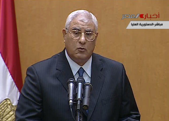 This image made from Egyptian State Television shows Egypt’s interim president Adly Mansour speaking after being sworn in at the constitutional court in Cairo, Thursday, July 4, 2013.