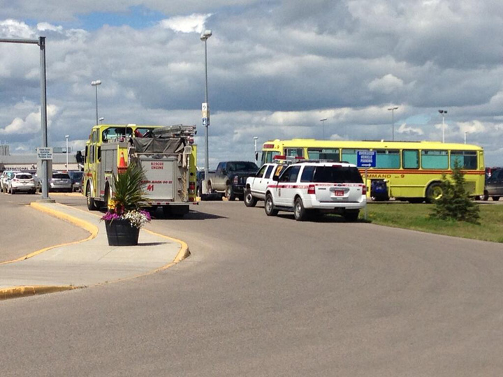 Saskatoon police investigate a possible suspicious package in the parking lot at John G. Diefenbaker Airport on Tuesday.