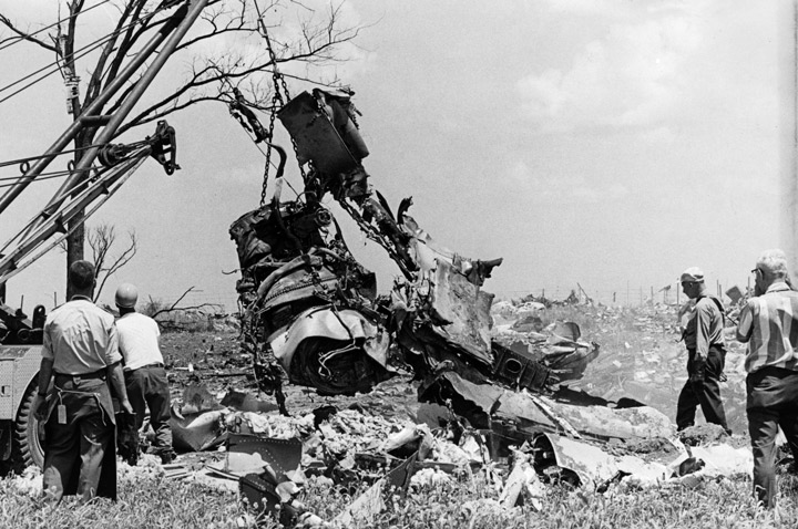 FILE--Investigators, in an attempt to determine the cause of a DC-8 crash, haul one of the engines from the main crater during cleanup on July 7, 1970. The Air Canada jetliner crashed when landing killing 97 passengers and nine crew members.
